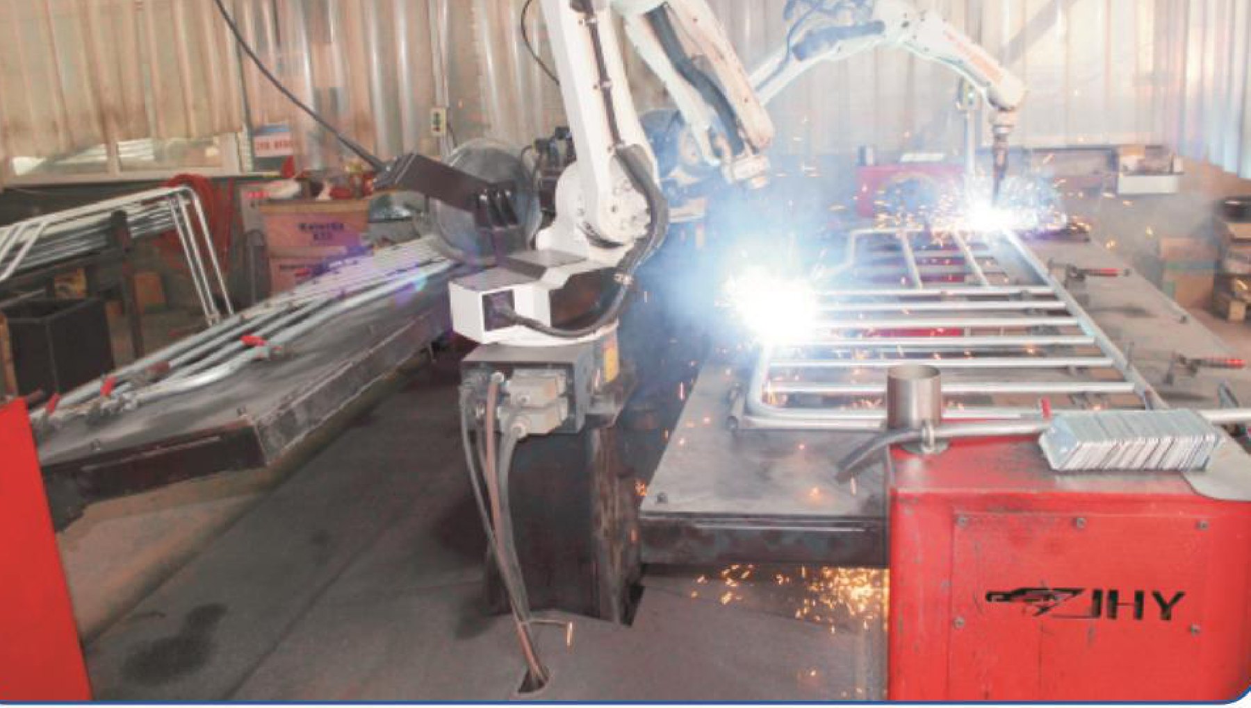 Robotic welding arms assembling galvanised penning frames at a KeMuHua production base